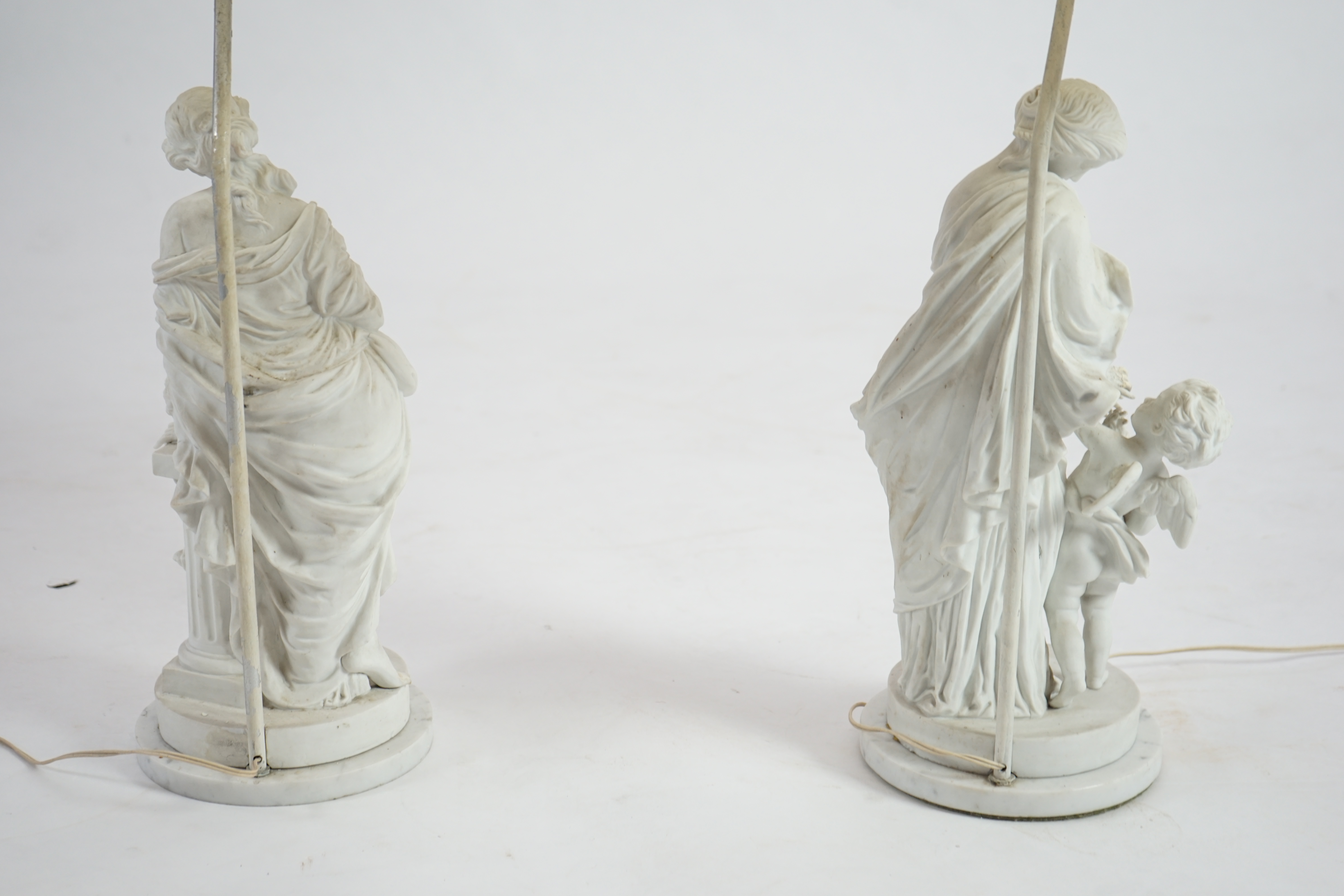 A pair of 19th century French bisque groups, depicting the seasons, Summer and Winter